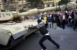 A lone protester steps into the path of an oncoming tank near Tahrir Square as demonstrations continued for a sixth straight day, January 30, 2011, in Cairo, Egypt. (Michael Robinson Chavez/Los Angeles Times) 1100430 A lone protester steps into the path of an oncoming tank near Tahrir Square as demonstrations continued for a sixth straight day, January 30, 2011, in Cairo, Egypt. (Michael Robinson Chavez/Los Angeles Times) 1100430